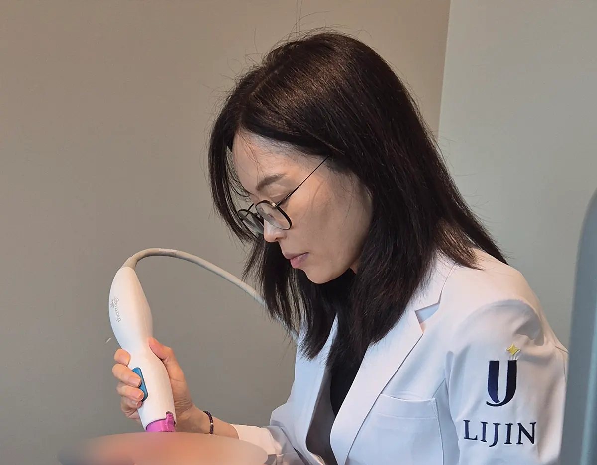 Lijin Clinic Myeongdong — english speaking clinic interior — Window-side recovery lounge overlooking Myeongdong